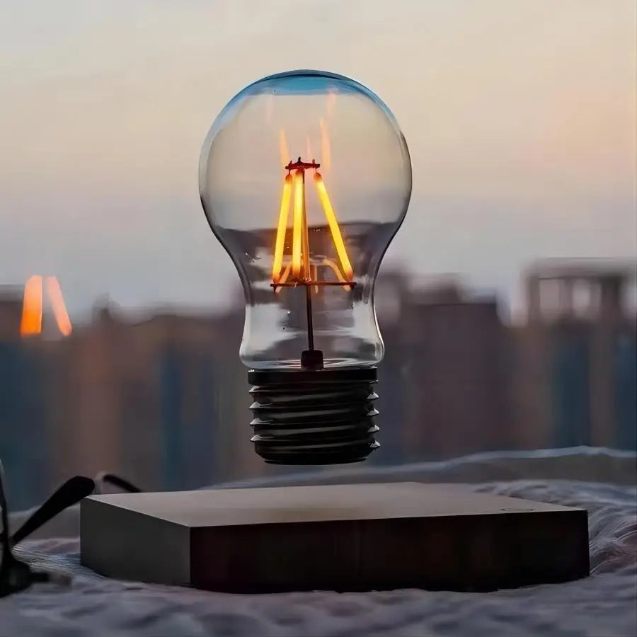 Lewitująca lampka LED w kształcie żarówki — magnetyczna lewitacja, podstawa z drewna | Norivo Norivo