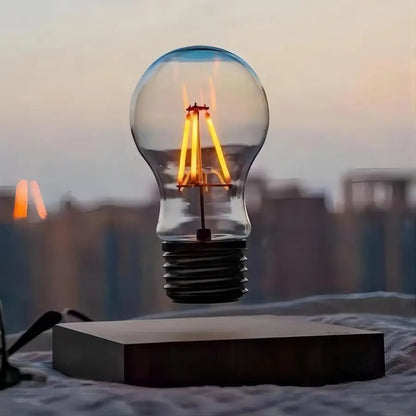 Lewitująca lampka LED w kształcie żarówki — magnetyczna lewitacja, podstawa z drewna | Norivo Norivo