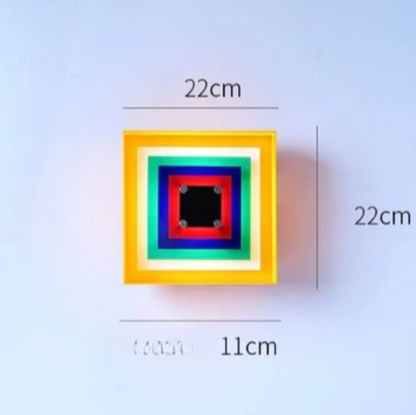 Designerski kinkiet ścienny Geometry — kolorowa lampa dekoracyjna z łańcuszkiem | Norivo Norivo